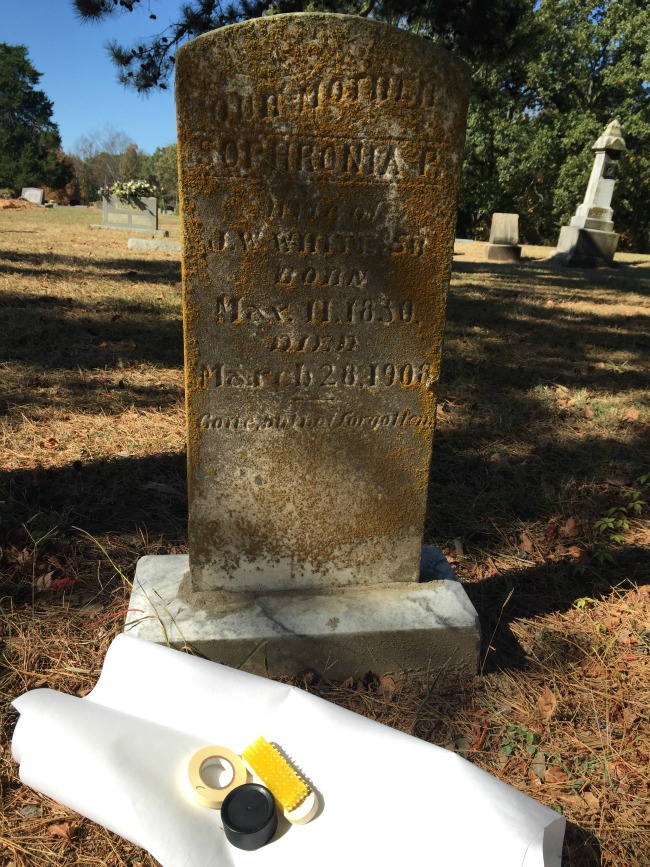 grave with rubbing supplies